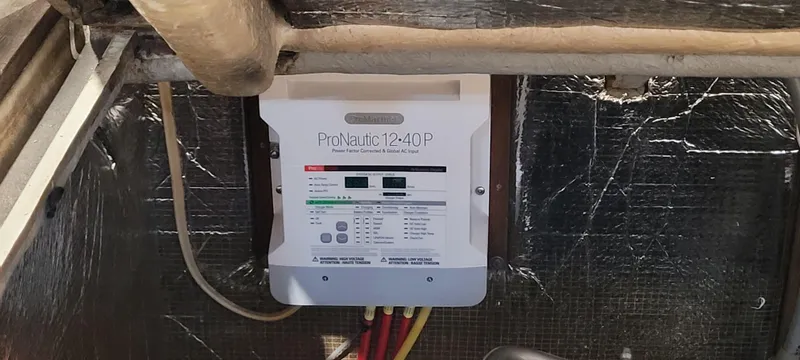 Slide: The Image of Battery charger in a 1996 Albemarle 27 Express boat engine compartment. - 27