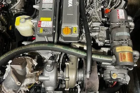 Slide: The Image of Engine of a 1996 Albemarle 27 Express boat, showcasing mechanical components and hoses. - 30