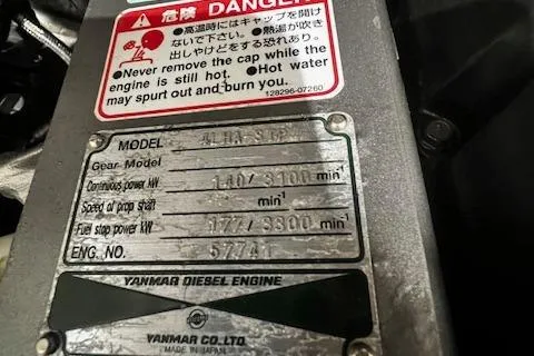 Slide: The Image of Yanmar diesel engine label with safety warning on a 1996 Albemarle 27 Express boat. - 33