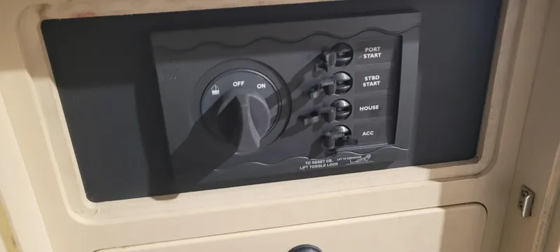 Slide: The Image of Control panel of a 1996 Albemarle 27 Express boat with switches and ignition. - 34