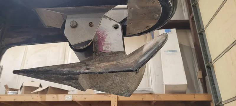 Slide: The Image of Close-up of a 1996 Albemarle 27 Express boat propeller in a garage setting. - 40