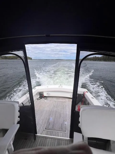 Slide: The Image of Albemarle 27 Express boat cruising on a lake, view from the cabin, 1996 model. - 48