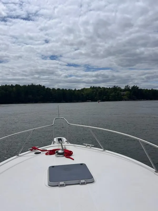Slide: The Image of Bow view of 1996 Albemarle 27 Express boat on a cloudy day. - 49