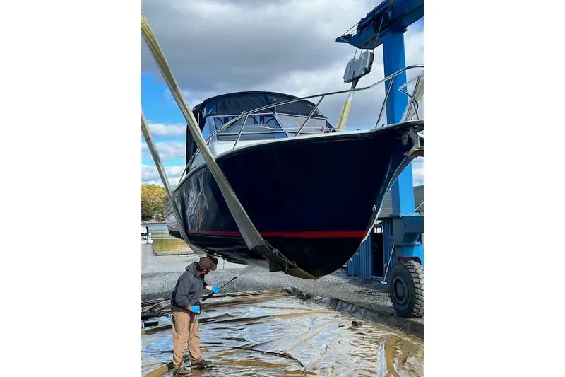 Slide: The Image of 1996 Albemarle 27 Express boat being lifted for maintenance. - 59