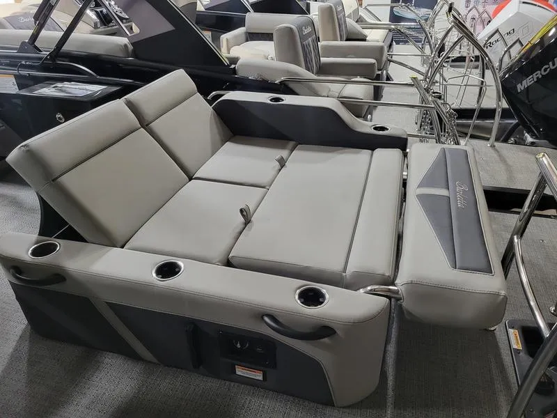 Slide: The Image of 2025 Barletta C24UE boat interior with gray seating and cup holders. - 14