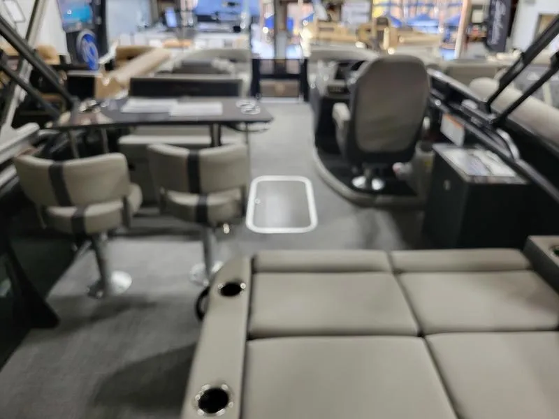 Slide: The Image of Interior of 2025 Barletta C24UE pontoon boat with seating and helm. - 16