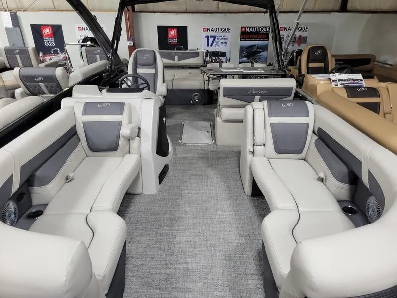 Slide: The Image of 2025 Barletta C24UE pontoon boat interior with luxurious seating and modern design. - 4