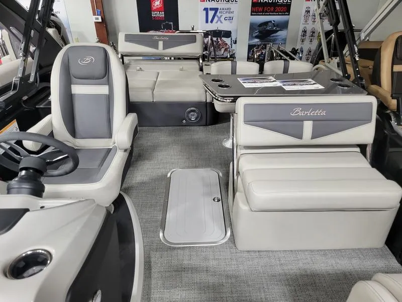 Slide: The Image of 2025 Barletta C24UE pontoon boat interior with luxurious seating and modern design. - 5