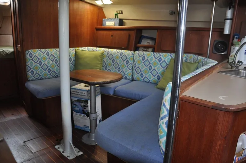 Slide: The Image of Interior of 1989 Hunter Legend 40 sailboat with cozy seating and wooden finishes. - 7