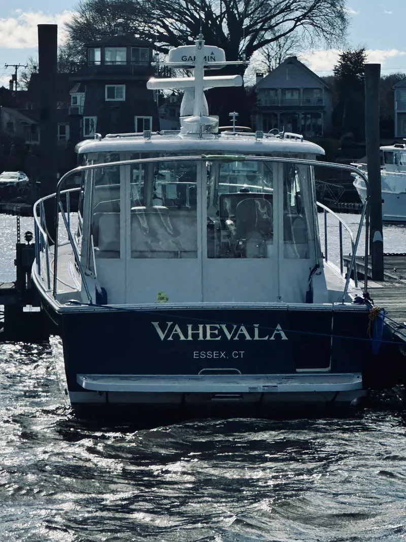 Slide: The Image of 2015 Back Cove 34 Express boat docked in Essex, CT marina. - 11