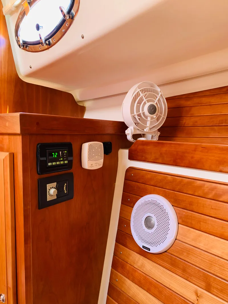 Slide: The Image of Interior of 2015 Back Cove 34 Express boat with wood paneling and electronic controls. - 20