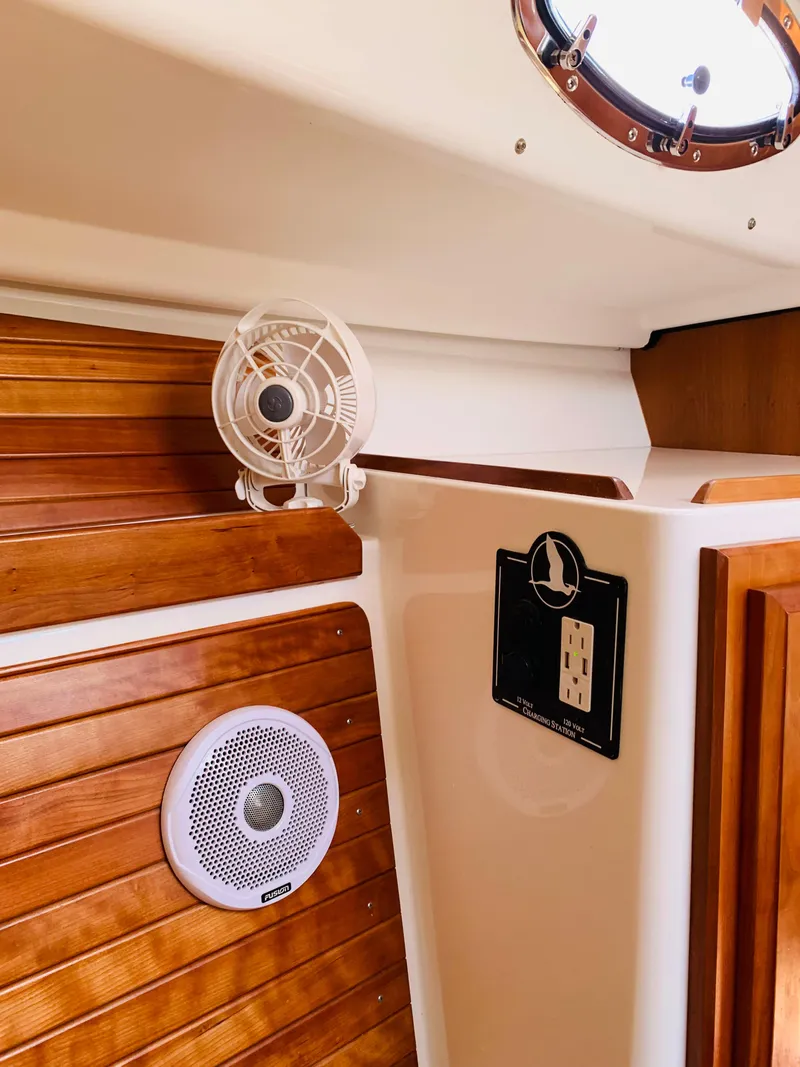 Slide: The Image of Interior of 2015 Back Cove 34 Express boat with wood paneling and fan. - 21