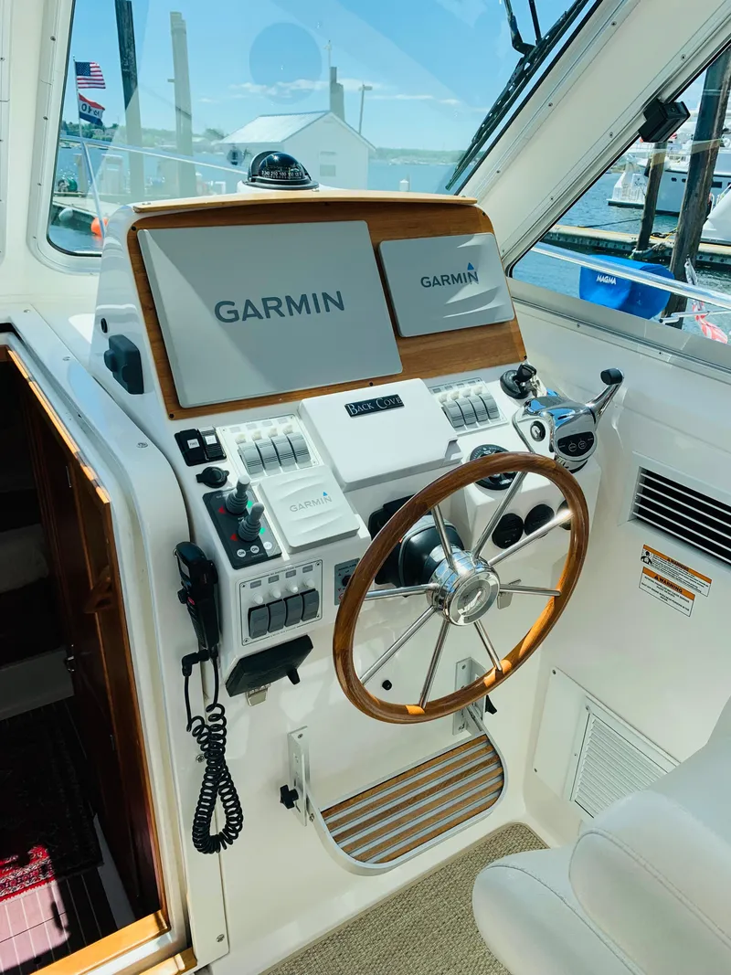Slide: The Image of Helm of 2015 Back Cove 34 Express with Garmin navigation system. - 30