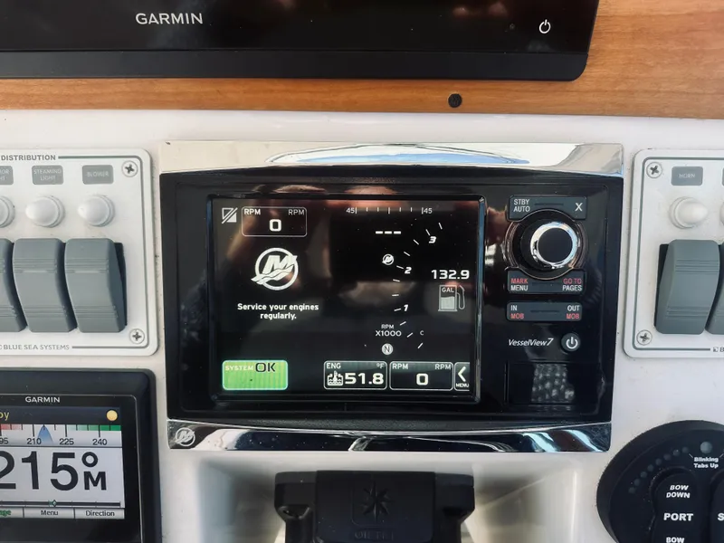 Slide: The Image of Control panel of a 2015 Back Cove 34 Express boat with Garmin navigation system. - 33