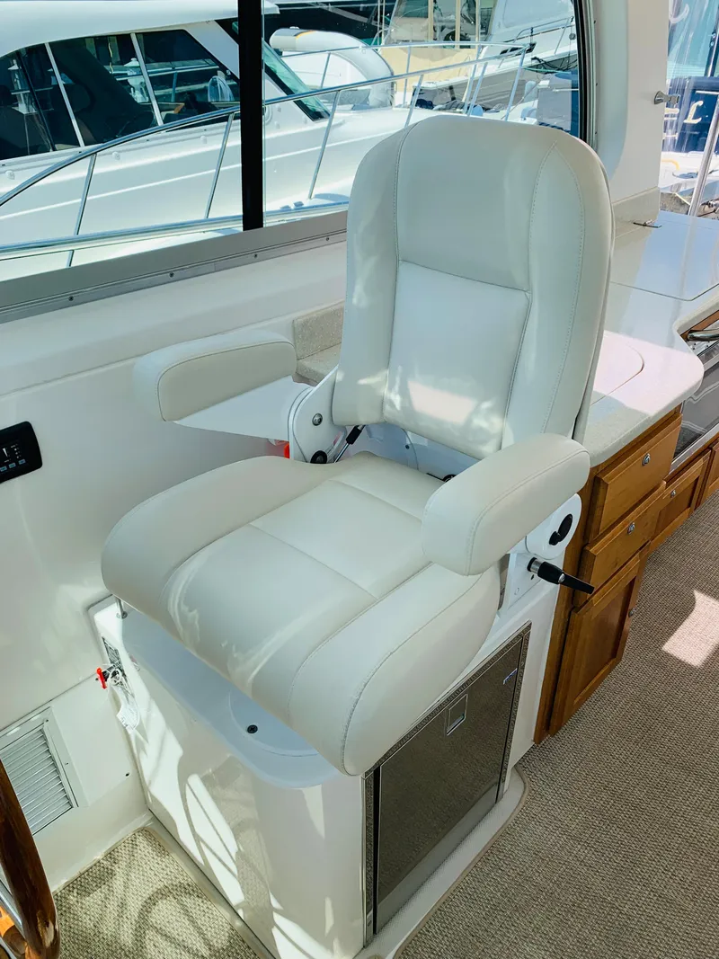 Slide: The Image of Luxurious captain's chair on 2015 Back Cove 34 Express yacht interior. - 35