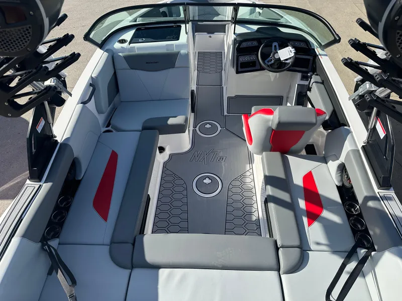 Slide: The Image of 2025 MasterCraft NXT21 boat interior with modern seating and sleek design. - 3