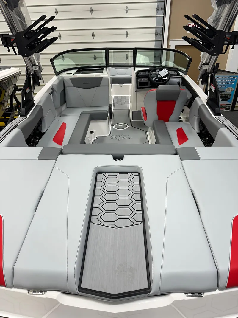 Slide: The Image of 2025 MasterCraft NXT21 boat interior with modern seating and sleek design. - 5