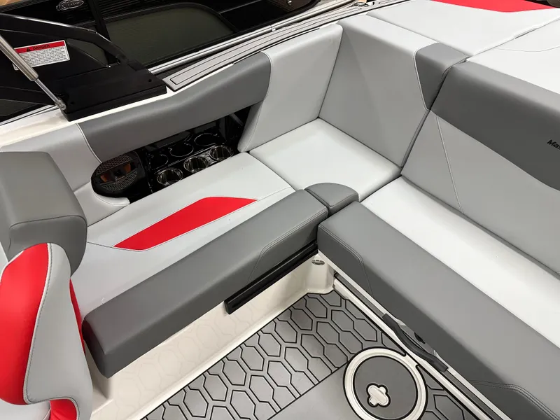 Slide: The Image of 2025 MasterCraft NXT21 boat interior with gray and red seating. - 9