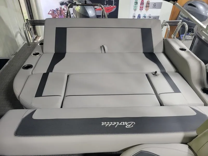 Slide: The Image of Barletta A20UC 2025 boat interior with luxurious seating and cup holders. - 12