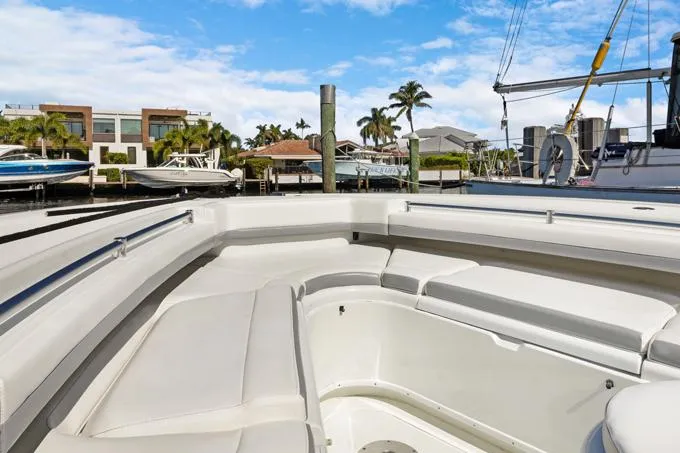 Slide: The Image of 2020 Yellowfin 39 Center Console boat docked in a sunny marina. - 16
