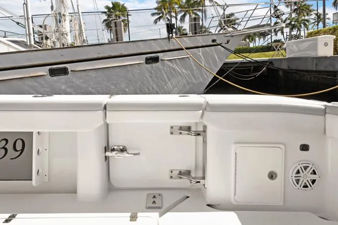Slide: The Image of 2020 Yellowfin 39 Center Console boat docked, showcasing sleek white interior details. - 30