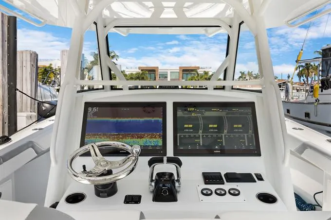 Slide: The Image of 2020 Yellowfin 39 Center Console boat dashboard with dual screens and steering wheel. - 5
