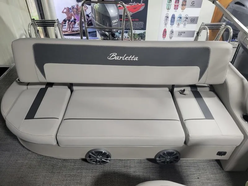 Slide: The Image of 2025 Barletta A20UC boat interior with gray seating and integrated speakers. - 10