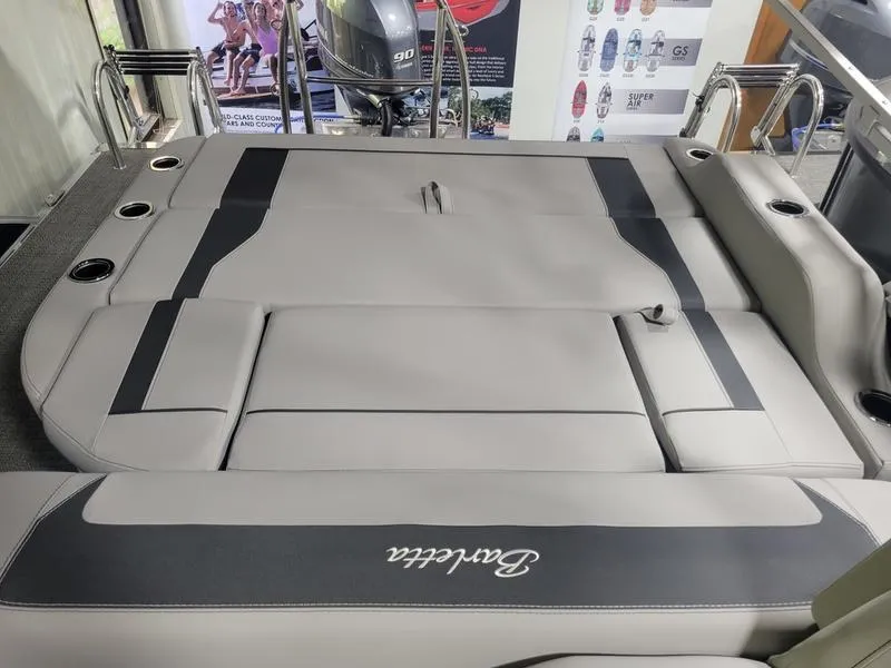 Slide: The Image of 2025 Barletta A20UC boat interior with gray seating and cup holders. - 11