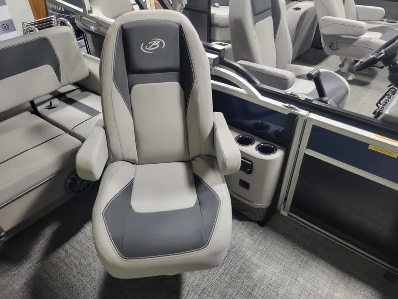 Slide: The Image of Barletta A20UC 2025 boat interior with comfortable seating and cup holders. - 9