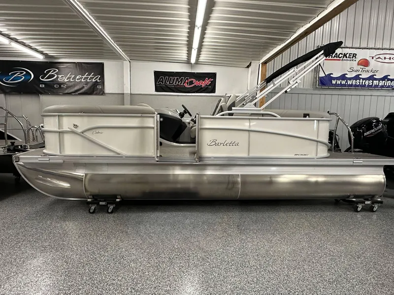 The Image of 2025 Barletta Cabrio 20QC pontoon boat displayed in showroom. - 0