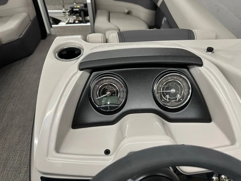 Slide: The Image of 2025 Barletta Cabrio 20QC dashboard with dual gauges and cup holder. - 10