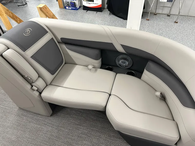 Slide: The Image of 2025 Barletta Cabrio 20QC boat seating, featuring luxurious gray upholstery and integrated cup holders. - 12