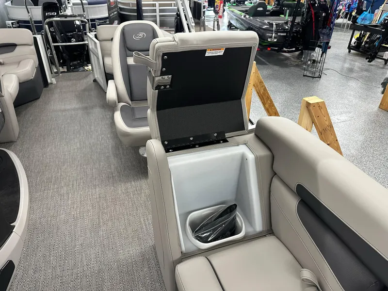 Slide: The Image of 2025 Barletta CABRIO 20QC boat interior with open storage compartment and seating. - 15