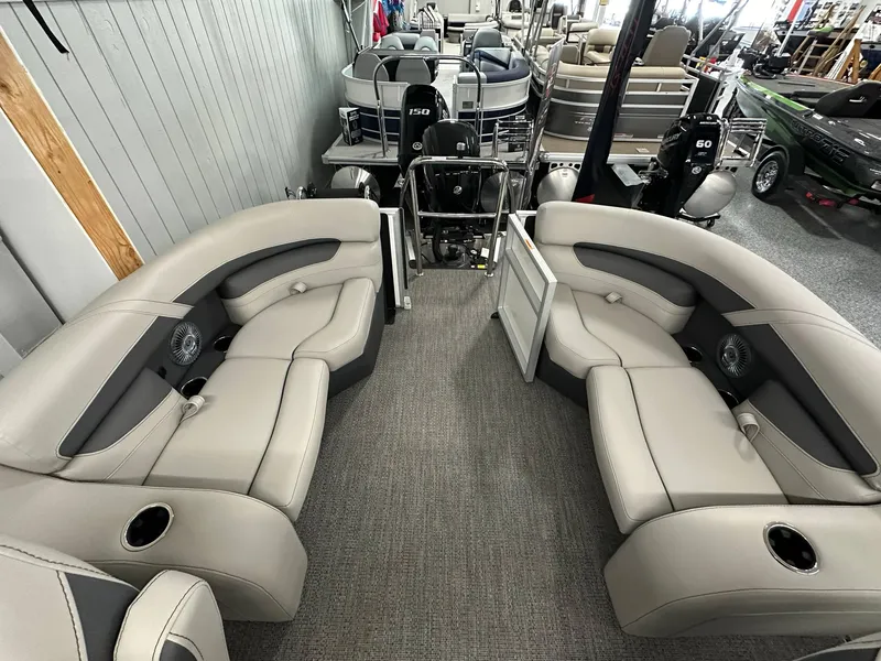 Slide: The Image of 2025 Barletta CABRIO 20QC pontoon boat interior with plush seating and modern design. - 17