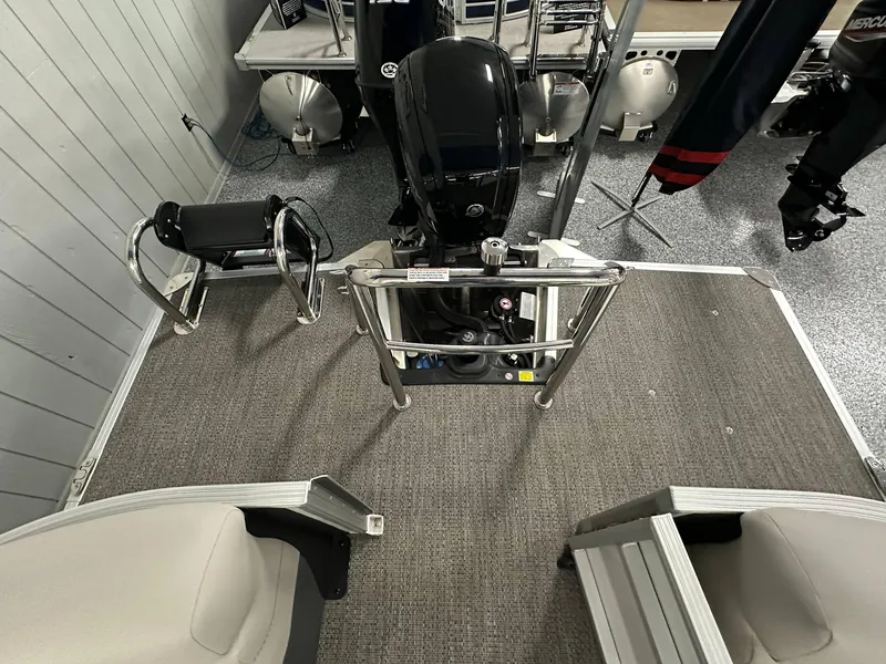 Slide: The Image of 2025 Barletta CABRIO 20QC boat interior with motor and seating area. - 18