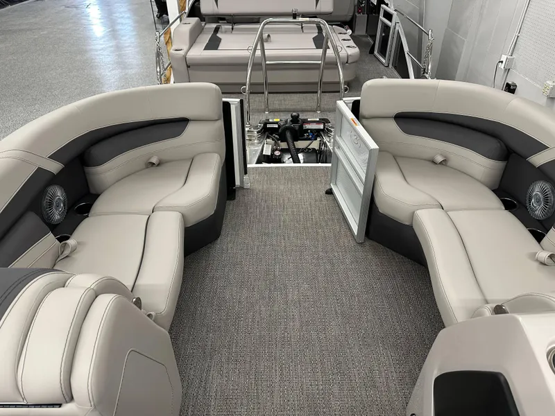 Slide: The Image of 2025 Barletta CABRIO 20QC pontoon boat interior with plush seating and modern design. - 5
