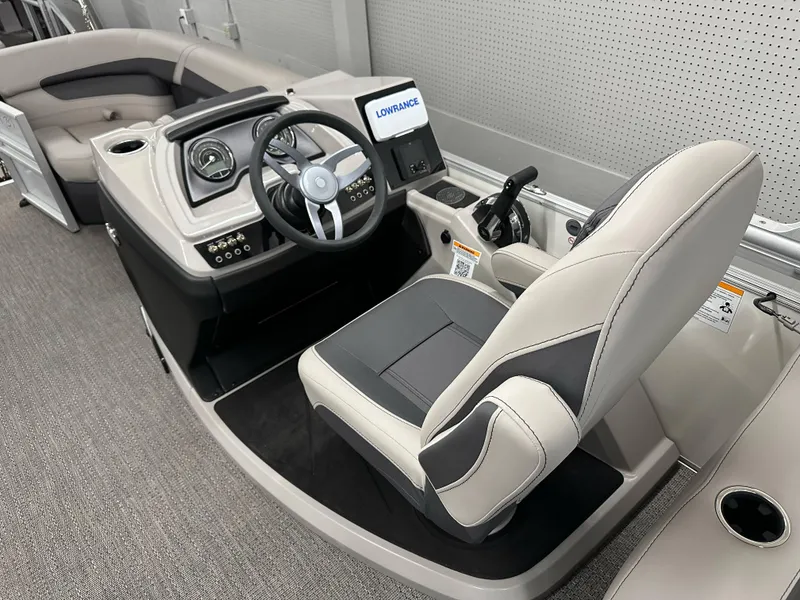 Slide: The Image of 2025 Barletta Cabrio 20QC boat interior with steering wheel and seating. - 7