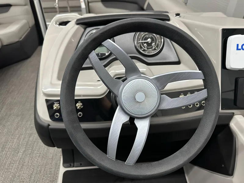 Slide: The Image of Steering wheel of 2025 Barletta Cabrio 20QC boat, featuring modern design and controls. - 9