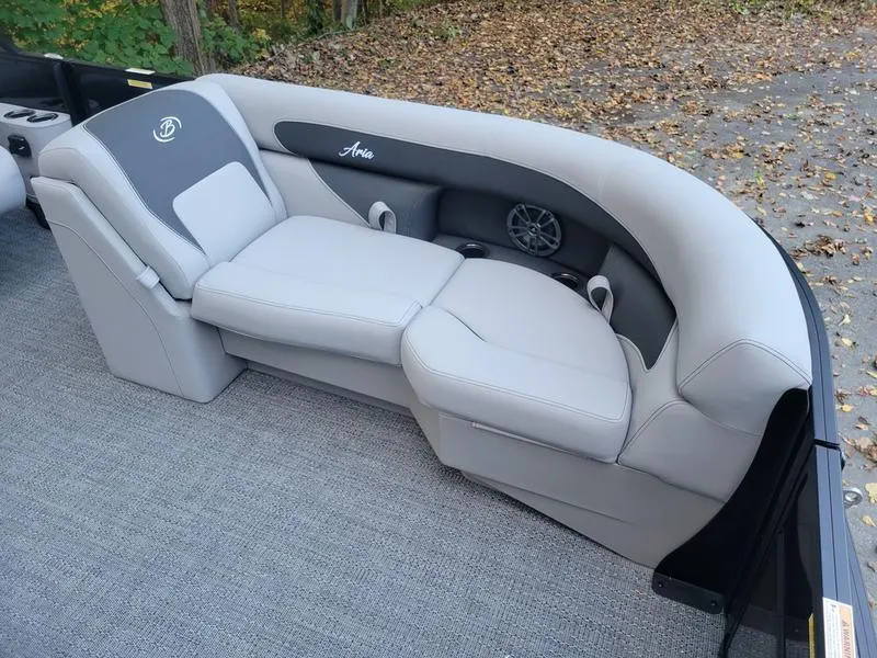 Slide: The Image of 2025 Barletta A20UC boat interior with plush seating and speaker system. - 9