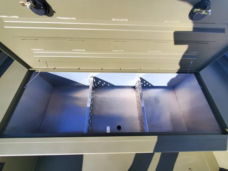 Slide: The Image of 2025 Lowe RX2070 boat with side console steering and camouflage seating. - 5