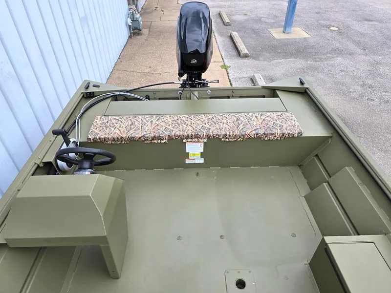 Slide: The Image of 2025 Lowe RX2070 boat with side console steering and camo seat cushion. - 7