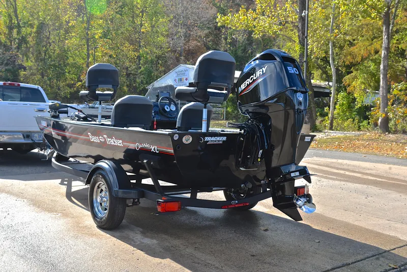 Slide: The Image of 2024 Bass Tracker Classic XL boat with Mercury engine on trailer. - 12