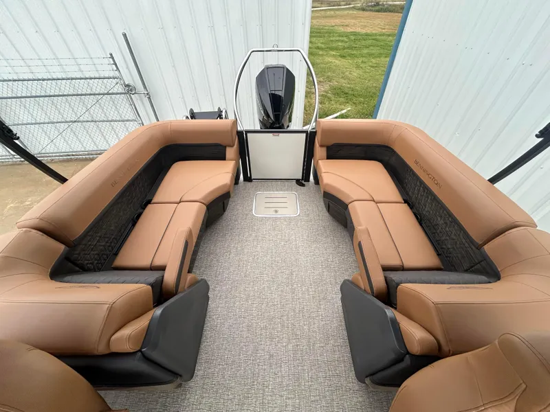 Slide: The Image of 2025 Bennington M26 boat interior with tan seating and modern design. - 8