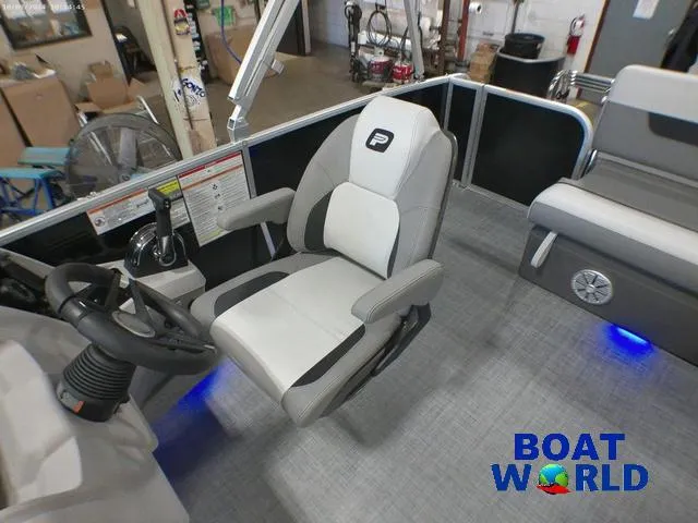 Slide: The Image of 2025 Princecraft Vectra 23 RL pontoon boat interior with captain's chair and lounge seating. - 12
