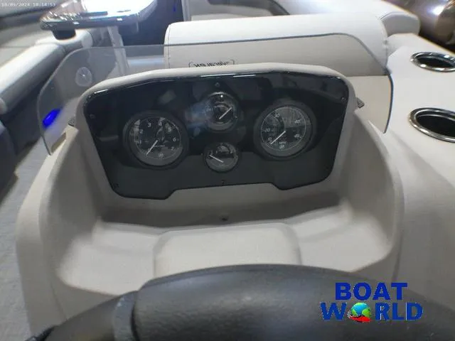 Slide: The Image of 2025 Princecraft Vectra 23 RL pontoon dashboard with gauges and steering wheel. - 14
