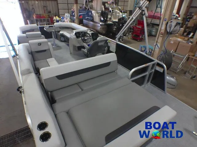 Slide: The Image of 2025 Princecraft Vectra 23 RL pontoon boat interior with lounge seating in showroom. - 19