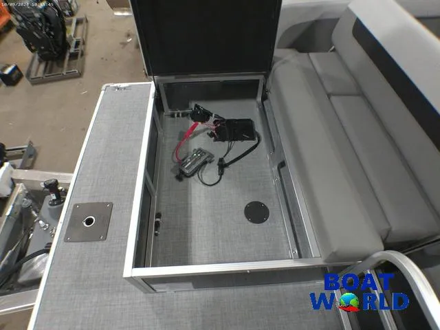 Slide: The Image of 2025 Princecraft Vectra 23 RL pontoon storage compartment with wiring, gray upholstery. - 21