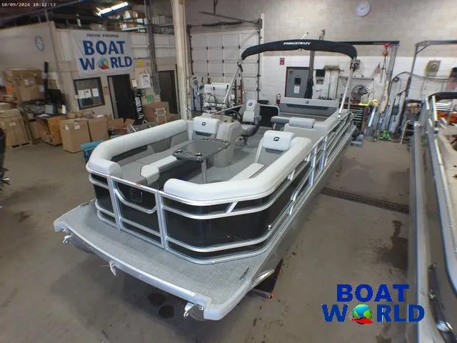Slide: The Image of 2025 Princecraft Vectra 23 RL pontoon boat in showroom, featuring lounge seating. - 3