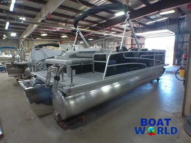 Slide: The Image of 2025 Princecraft Vectra 23 RL pontoon boat in a showroom, featuring a Mercury engine. - 37