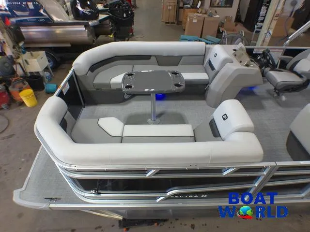 Slide: The Image of 2025 Princecraft Vectra 23 RL pontoon boat interior with lounge seating and table. - 4